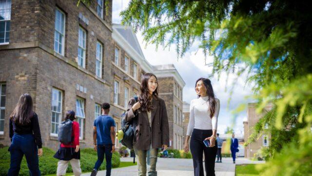 students walking through university of leicester campus